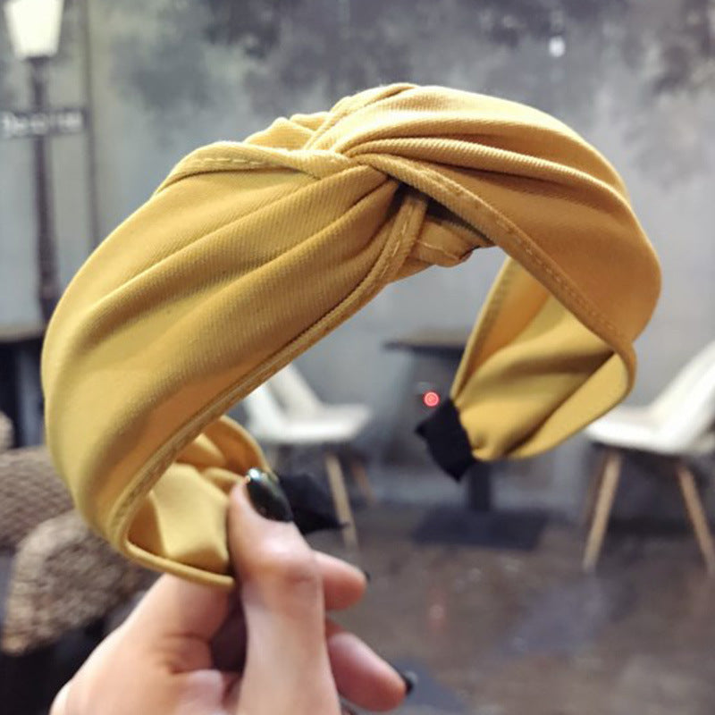 Wide-sided cross-knotted headband