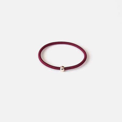 Elastic rubber band with beads