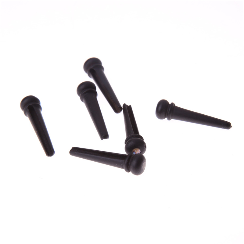 Guitar string nail pressing string post