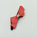 Twisted clip with herringbone bow
