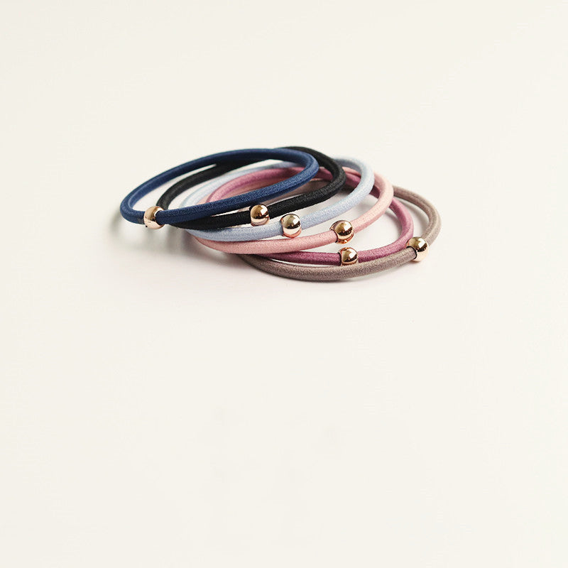Elastic rubber band with beads