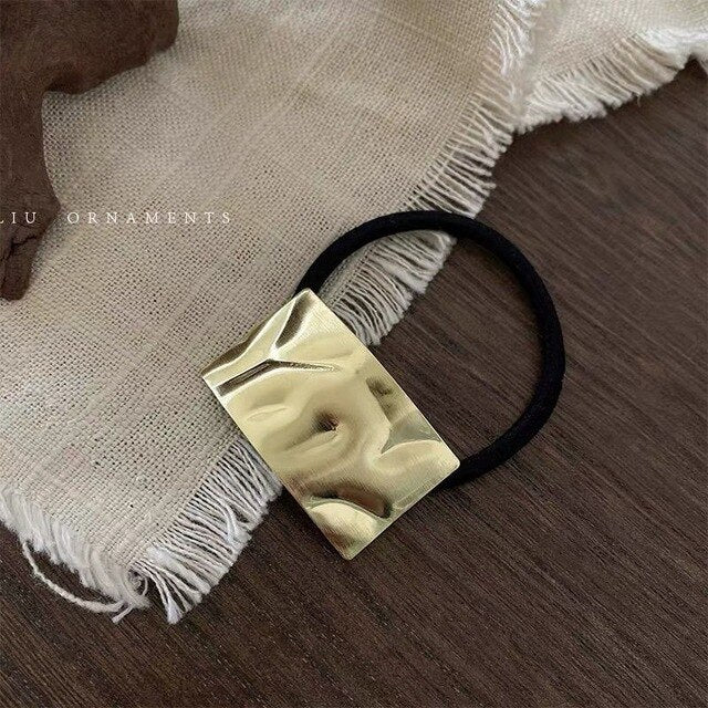 High stretch metal brushed hair rope