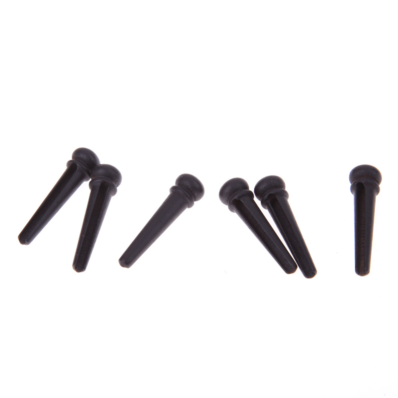Guitar string nail pressing string post