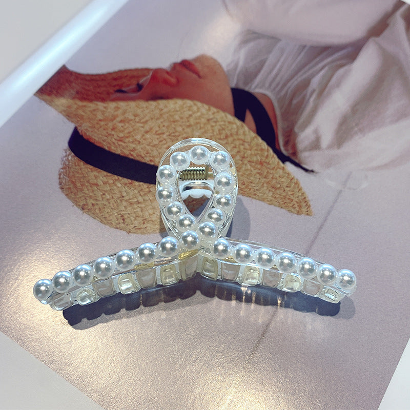Head ornament with a clip on the back of the head