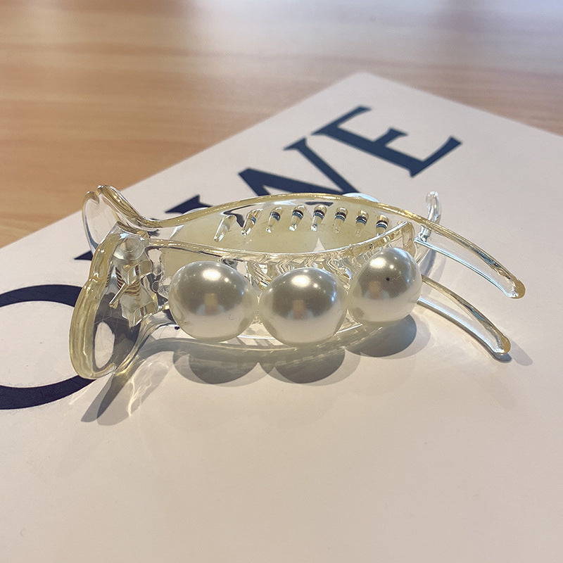 Head ornament with a clip on the back of the head