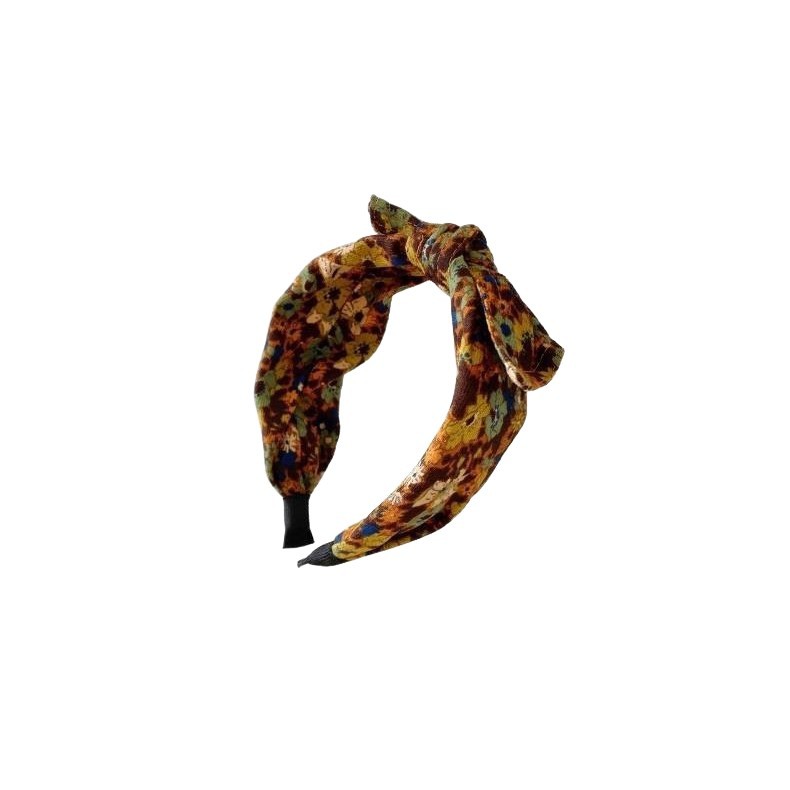 Simple Wide-brimmed Fabric Hairband With A Printed Pattern And A Tied Knot
