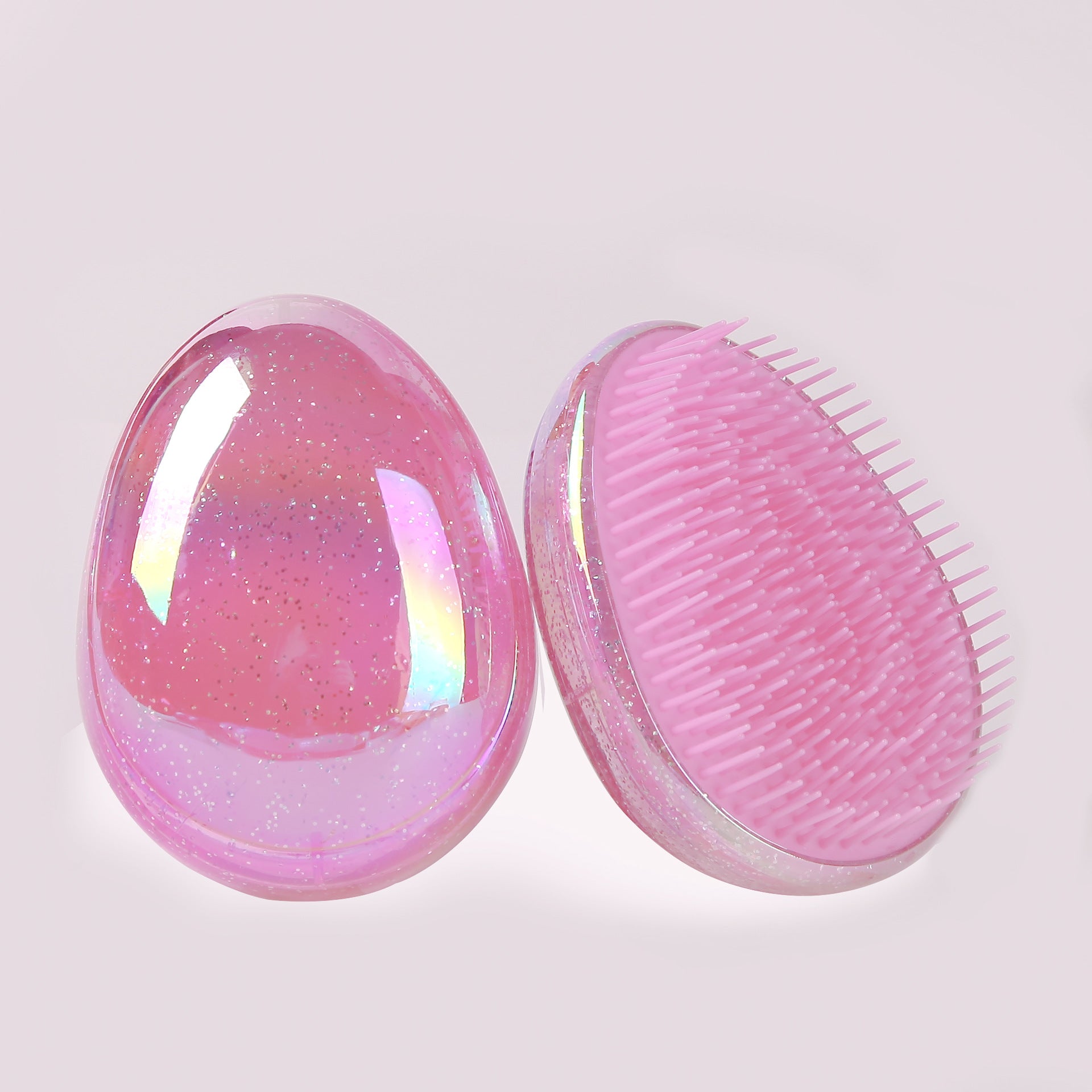 Egg-shaped plastic comb