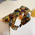 Simple Wide-brimmed Fabric Hairband With A Printed Pattern And A Tied Knot
