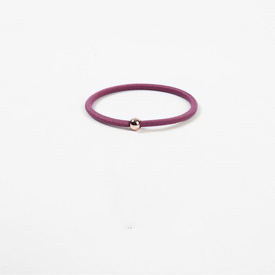 Elastic rubber band with beads