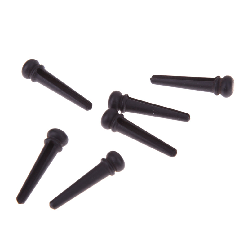 Guitar string nail pressing string post