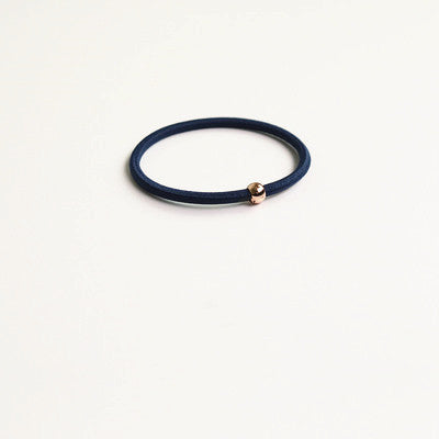 Elastic rubber band with beads