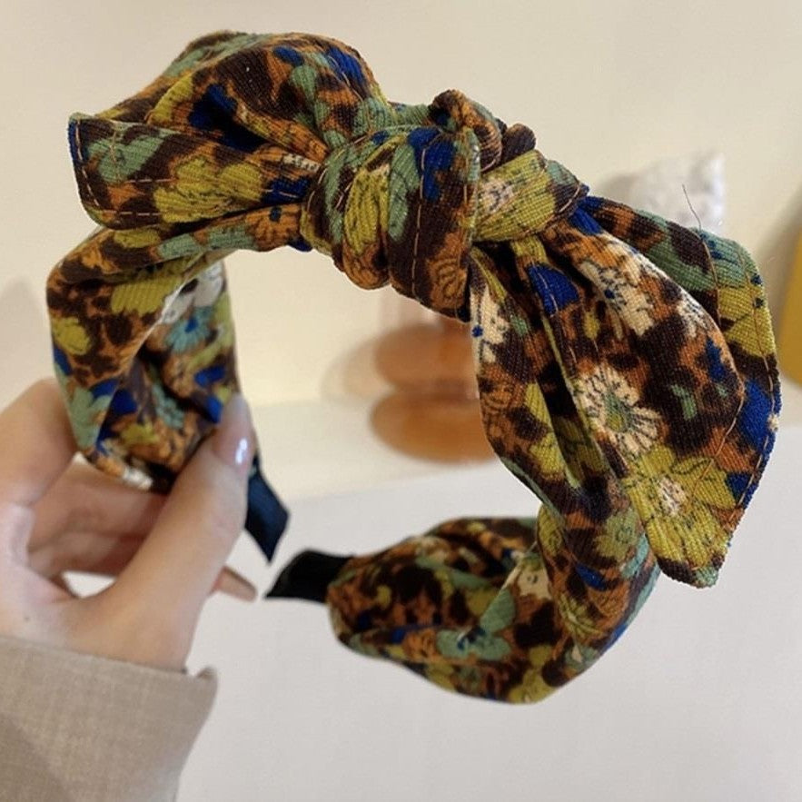 Simple Wide-brimmed Fabric Hairband With A Printed Pattern And A Tied Knot